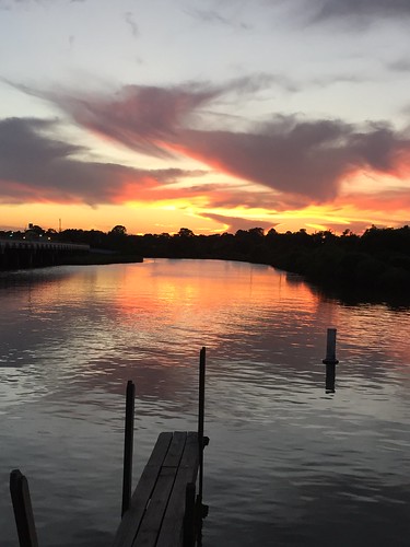 sunset reflection water chelsea texas boatdock ellago
