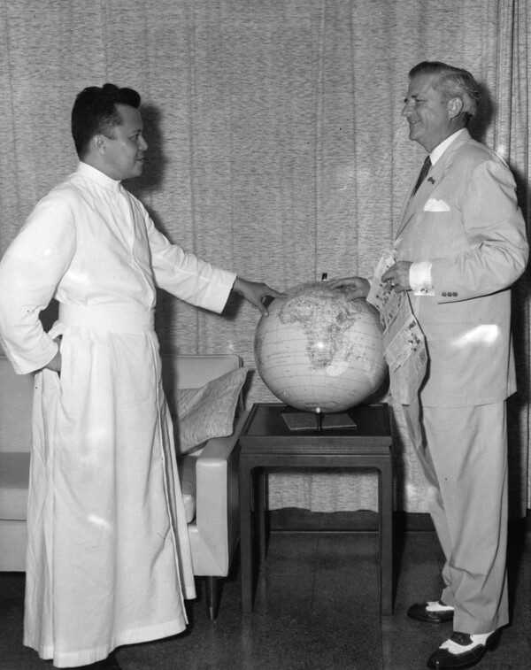 Governor Bill Daniel, Governor of Guam from 1961 – 1963, and Monsignor Felixberto Flores, 1961. Guam Police official photograph, courtesy of the Micronesian Area Research Center (MARC).