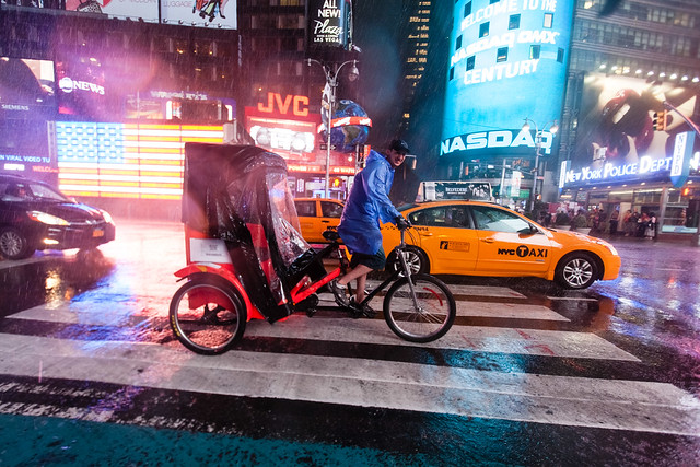 Bicycle-cab in Times Square storm