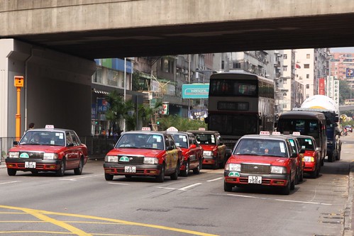 Pack of Hong Kong taxis waiting for a green light
