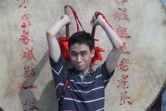 Lee beating drum at Great Wall of China at Shan Hai Guan
