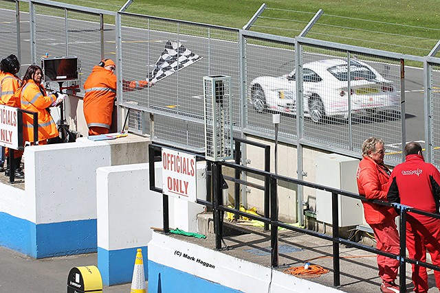 The chequered flag in the Ginetta Racing at the 2012 BTCC weekend at Donington Park in April 2012