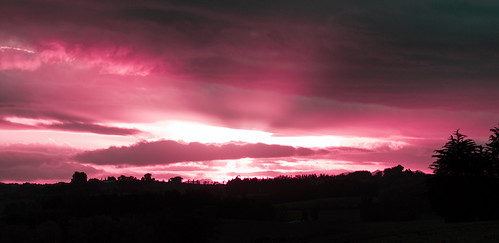 Sunset Over Southland by thebushdoctor, The sun breaking through clouds about 30 min before sunset.
Hue altered and blacks increased to ma