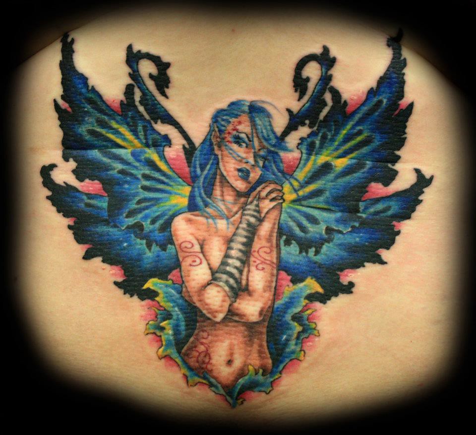 Evil sexy fairy lower back tattoo by Jackie Rabbit.