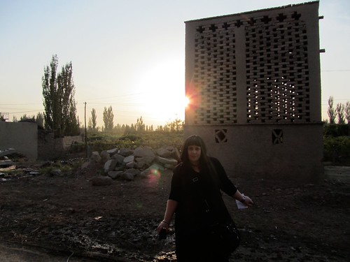 Sunset on the vineyards by oh contraire, Near Emin minaret, Turpan. The building with the holes in it is used for drying grapes into raisins.