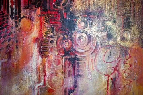Looping circles in red and grey over pale paint