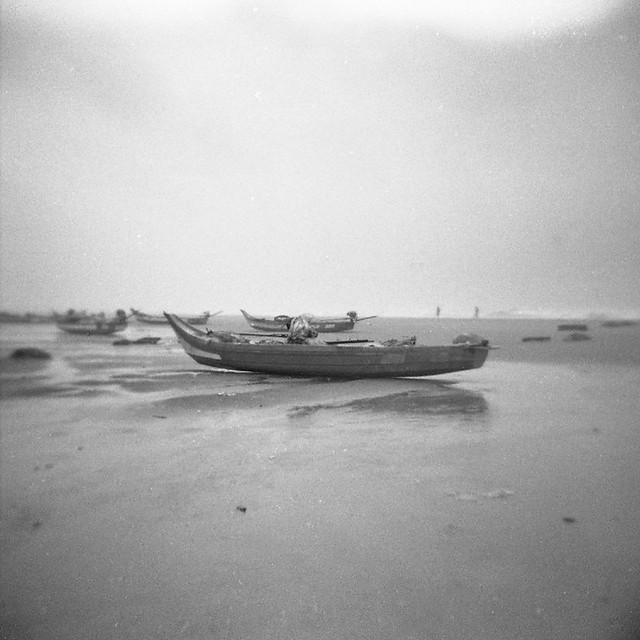 beached fishing boats after cyclone thane