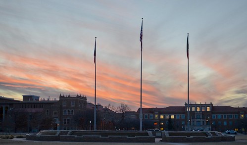 sunset orange clouds flags texastech ttu memorialcircle