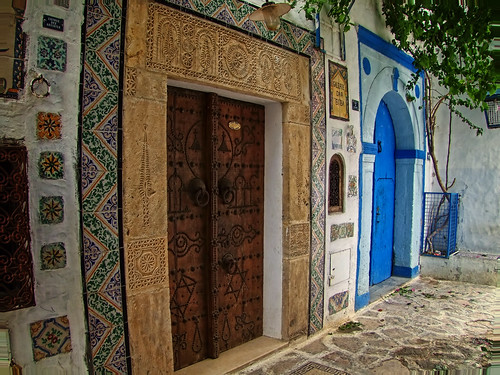 africa street door wood old city blue brown white distortion color colour green art window metal stone lens design town carved ancient colorful mediterranean doors fuji zoom tunisia folk antique crafts tunis arts vine wideangle folklore pebbles carving medieval historic arabic fisheye ornament tiles arab shade finepix medina colourful oriental orient passage cobbles decor hammamet authentic whitewash decorated topaz lightroom ornamented maistora s100fs