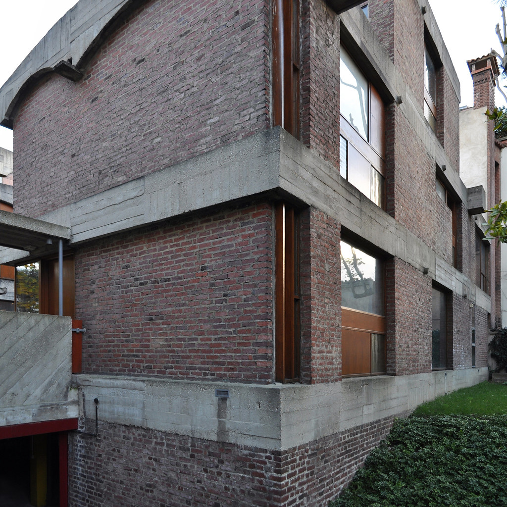 Modern brick house with concrete balconies