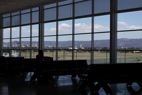 Looking through the Adelaide Airport windows towards the CBD skyline