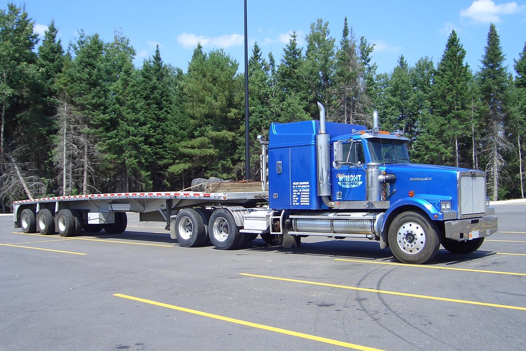 WRIGHT TRUCKING Western Star Truck with a tridem triaxle flatbed trailer Huntsville, Ontario Canada taken in 2004 ©Ian A. McCord