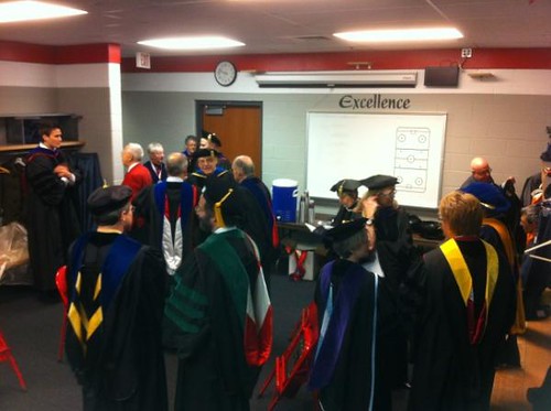 Chancellor, Provost, Deans et al. getting ready for #uwgrad ceremony at visiting hockey locker http://t.co/6VMcKcHm