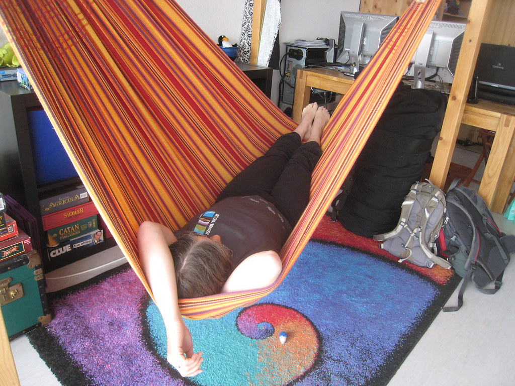 A woman relaxes on a hammock