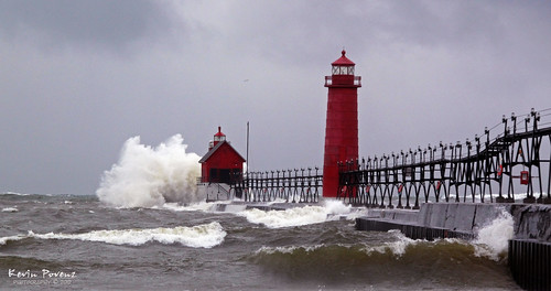 red lighthouse lake snow beach wet water clouds pier waves wind michigan january shore splash grandhaven tpslandscape