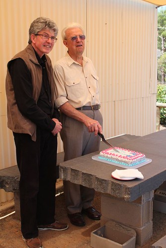 Designer Peter Templeton and Keith Graetz cutting the birt… | Flickr