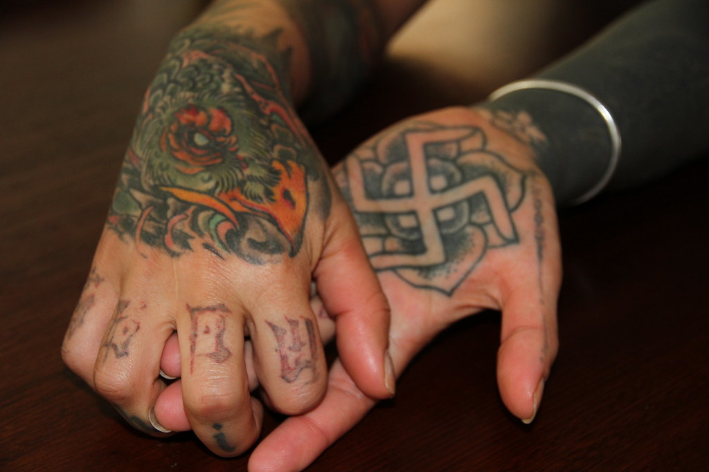 Tattoos of a phoenix and the ancient swastika symbol | Flickr