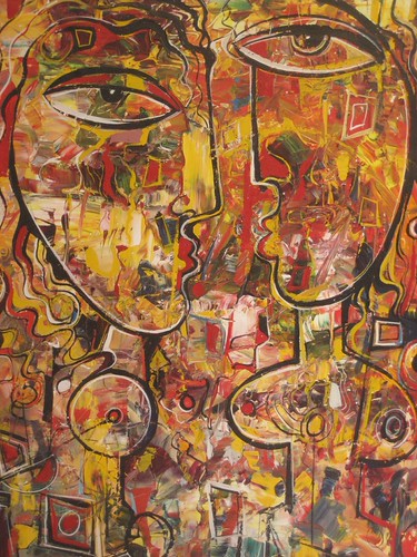 Two long faces over a golden textured background