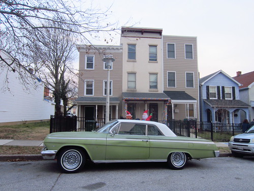 vintage car auto outside street winter christmas odd strange scene landscape houses shapes cool colors green blue gray grey white baltimore city urban maryland usa hampden impala whitewalls staggered slanted curious parked waving explore funny fun