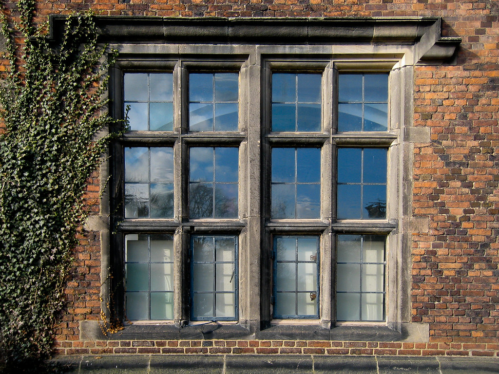 Detailed architectural design of a historic window at Sudbury Hall, Derbyshire, UK.