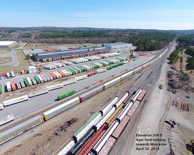 Aerial view of train POSE with CSX 751 and #789 passing through Ayer yard on April 20, 2014