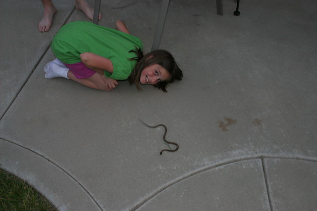 Annie with the snake in the backyard