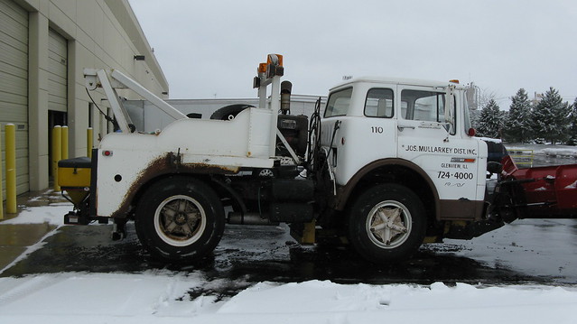 1974 Ford 750 Custom Cab tow truck equipped with a snowplow.  Glenview Illinois USA. Friday, February 24th, 2012.