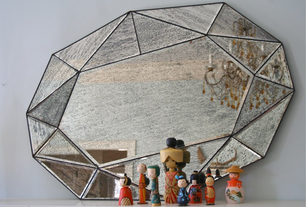 kokeshi, a gem mirror, and an old italian chandelier