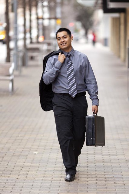 Hispanic Businessman - Walking Downtown With Briefcase