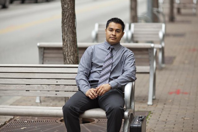 Hispanic Businessman - Sitting on Bench with Briefcase