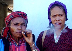 Women smoking in the Maubisse Sunday market, Timor Leste