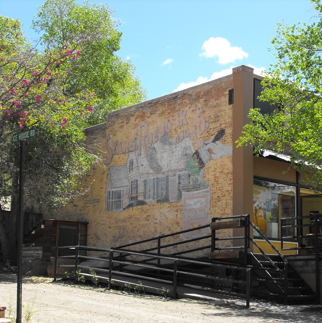 Store with a mural showing a Sears add, Madrid, NM