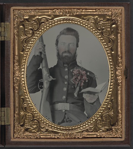 [Private David Lowry, of Company E, 25th Virginia Cavalry Regiment, Company A, 41st Virginia Infantry Regiment, and Company D, 47th Virginia Infantry Regiment, in uniform and corsage of flowers with musket and book] (LOC) | by The Library of Congress