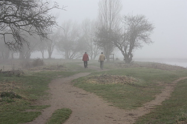 The same two walkers along the Thames