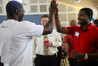 Brian Sealey gives a high five as David Lloyd looks on after the awards ceremony at Guardian ad Litem Appreciation Day on May 12, 2012 in Tallahassee, Florida. | by flguardian2