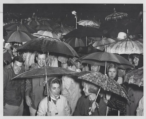 #BBN is always #trueblue when it comes to cheering on the Wildcats, like these fans at @ukhomecoming in 1962. Rain or shine we look forward to seeing our alums & fans as @ukfootball takes on EKU tomorrow. #UK100HC #Raceto100 #OnOnUofK #AllIn  Photo by @ke