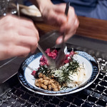 Takashi - Server Mixing Natto and Beef Tartar