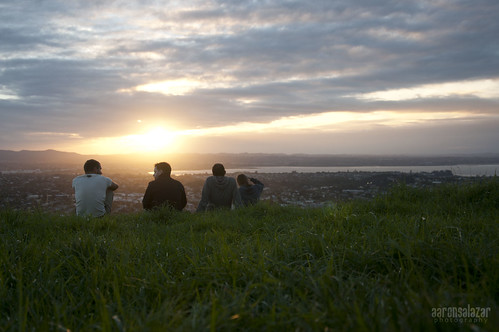 city friends sunset sky green grass chat view time hill talk aerial overlooking domain