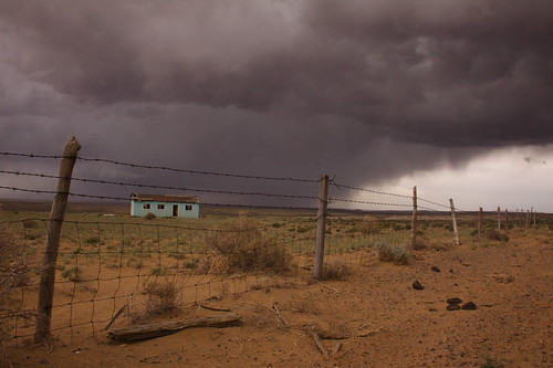 We aren't in Kansas anymore, newmexico fence dark landscape ominous empty abandonedhouse lonely chacocanyon darkskies stormyskies