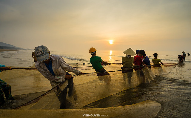 Traditional fishermen are pulling the seine (fishing net) from the sea