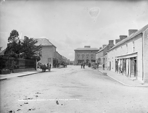 trees ireland bicycle children suits donkey bakery material ladder cart cloths crate railings sugarbeet dung marketsquare policemen phelan glassnegative 1890s regulations carlow leinster robertfrench williamlawrence nationallibraryofireland bagenalstown fuls lawrencecollection lawrencephotographicproject federationforulsterlocalstudies federationoflocalhistorysocieties hkelly kellysdrapers