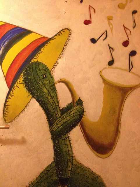 Cactus playing a saxophone