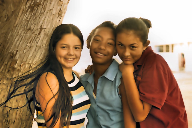 Three teens girls of High School posing.