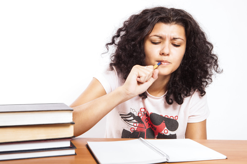 School | A college girl is studying for her end of year exam… | Flickr