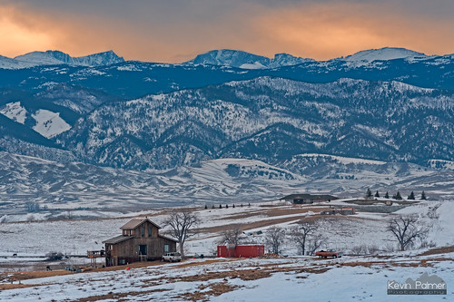 buffalo wyoming winter january cold snow snowy nikond750 nikon180mmf28 telephoto cabin wood wooden ranch house home bighornmountains evening sunset sky gold golden colorful orange clouds trees foothills