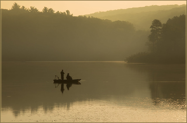 Fishermen out on the morning mist