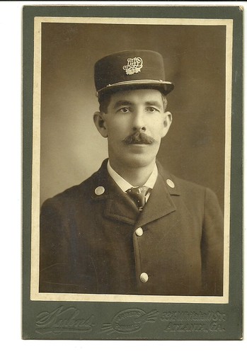 ATLANTA PHOTOGRAPHERS - W. T. KUHNS 33 1/2 WHITEHALL ST., ATLANTA.  FIREMAN IN UNIFORM. The hat says "AFD 62". | by ATLANTA COLLECTIBLES - 19TH & EARLY 20TH CENT