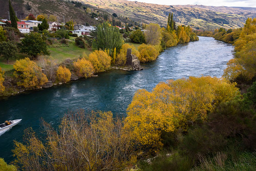 autumn trees newzealand sky water clouds buildings river landscape hills southisland centralotago jetboat rune roxburgh cluthariver tripdownsouth teviotvalley