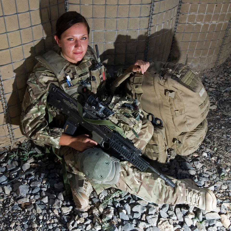 Female Army medic in Helmand with the Guards: A young female combat medic i...