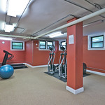 Bright red walls give this fitness room a "Go for it!" feeling of encouragement.  